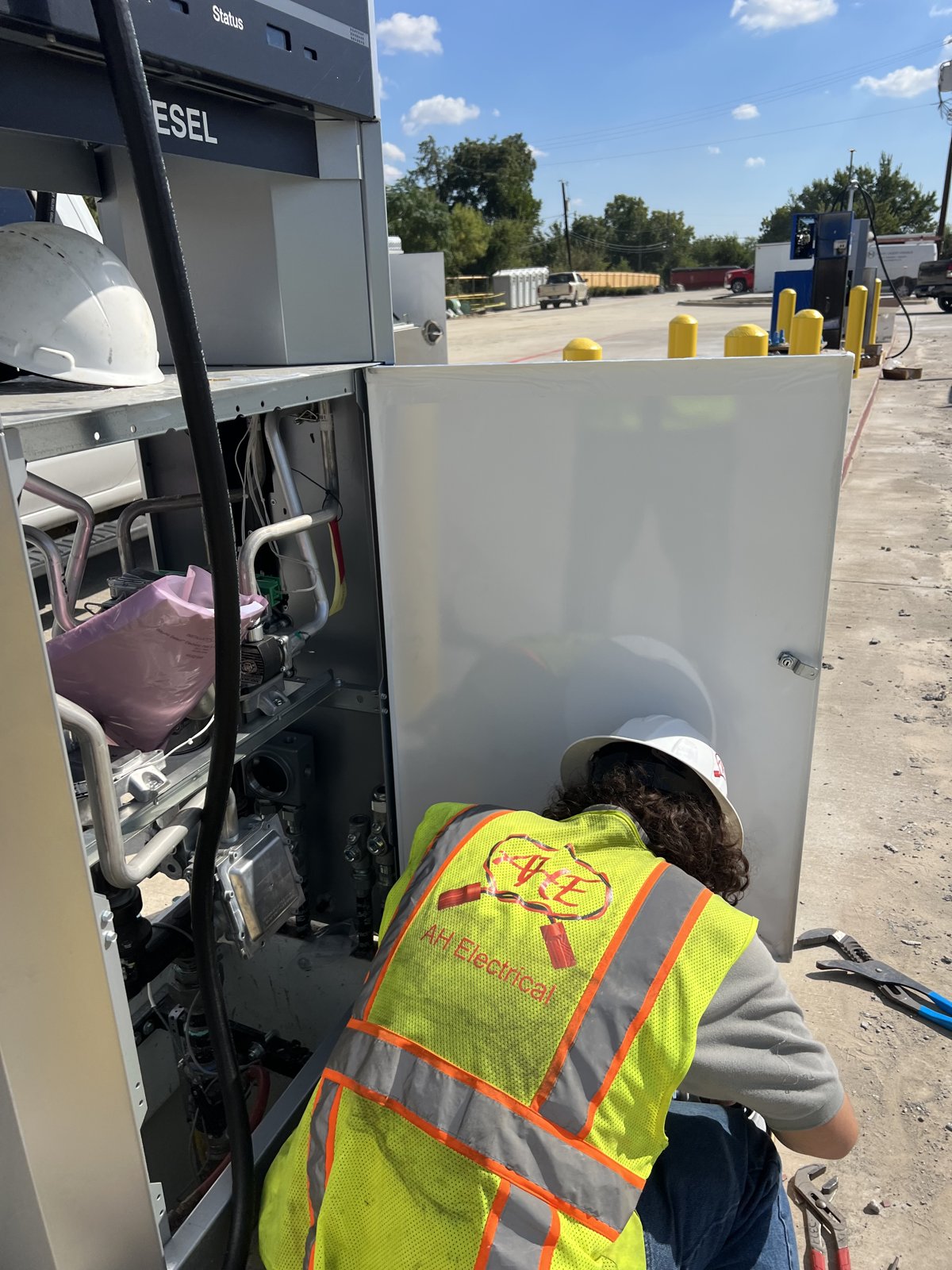 A.H. Electrical technician servicing a diesel fuel dispenser