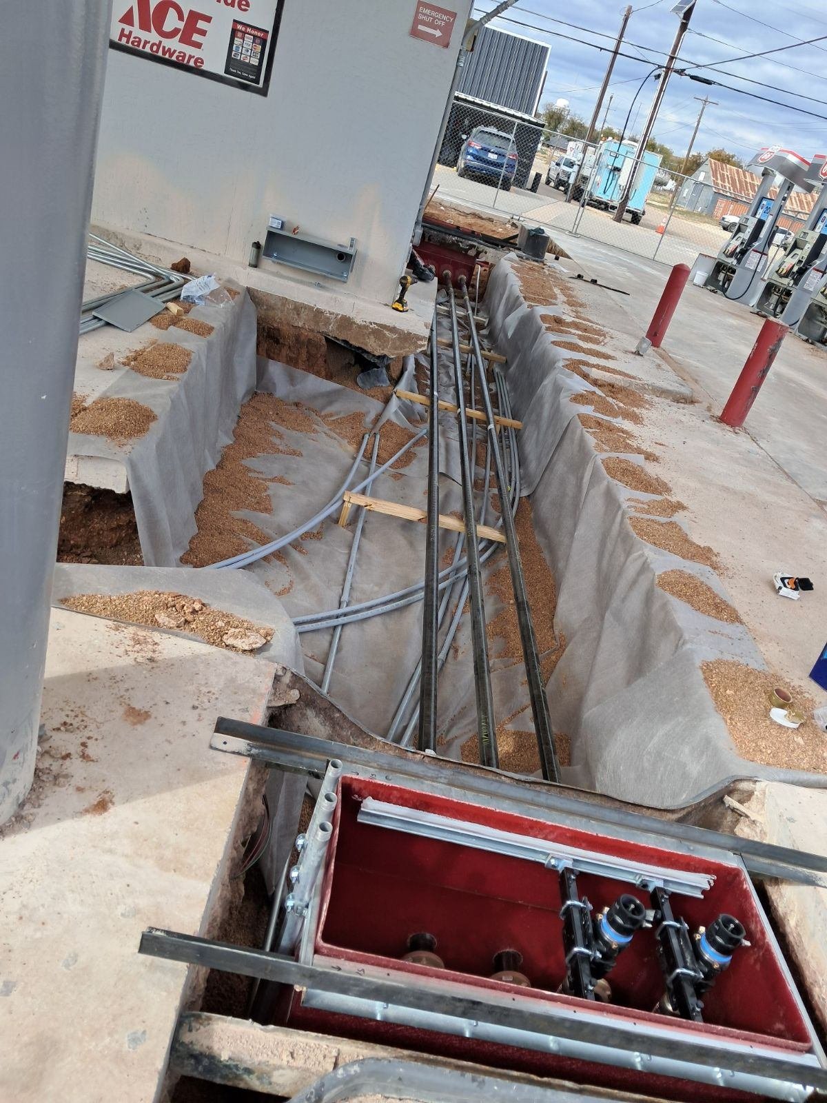 Underground conduit trench at a gas station fueling site